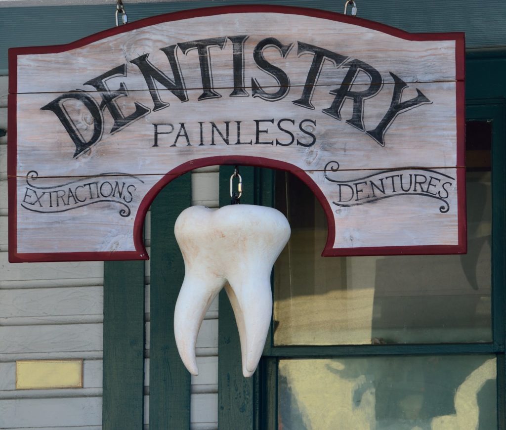 painless dentistry sign